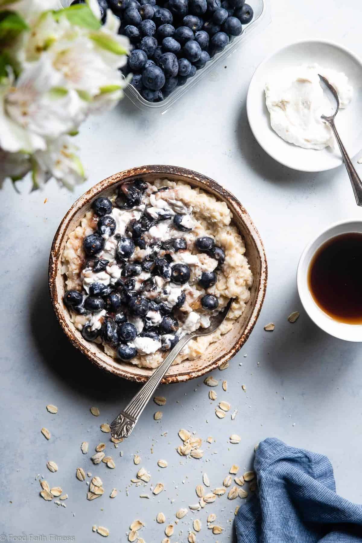 Blueberry Cheesecake Oatmeal - This quick and easy Blueberry Oatmeal with Cheesecake Swirl is a healthy, low fat and gluten free breakfast that tastes like waking up to cheesecake! | #Foodfaithfitness | 