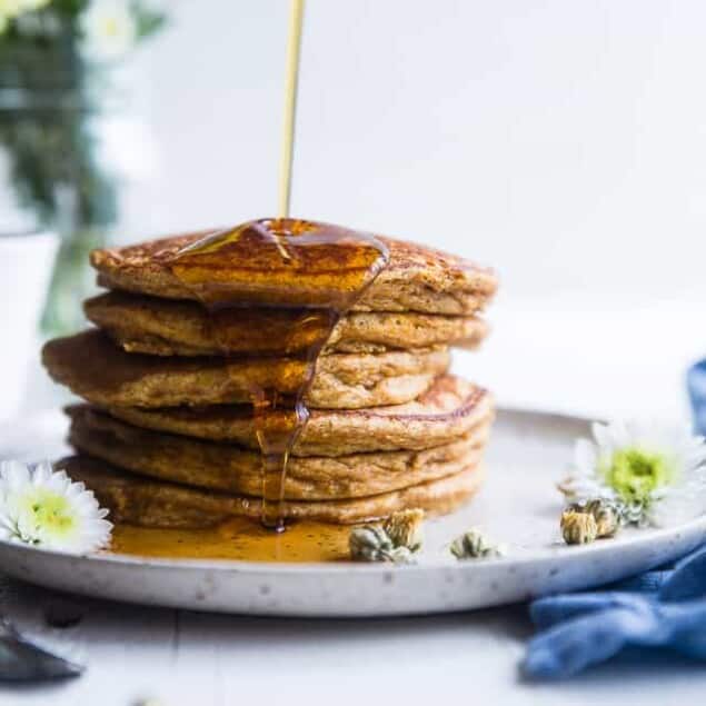 Gluten Free Paleo Sweet Potato Pancakes - SO fluffy and tender that you won't believe they're made without butter or oil! Perfect for a healthy breakfast and freezes great for busy mornings! | #Foodfaithfitness | #Glutenfree #Paleo #Healthy #Dairyfree #Pancakes