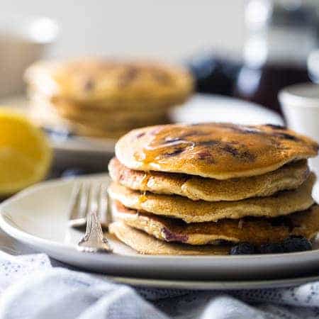 Quinoa Blueberry Lemon Gluten Free Pancakes - Made with Greek yogurt for a healthy breakfast that is packed with protein and perfect for Spring! | Foodfaithfitness.com | @FoodFaithFit