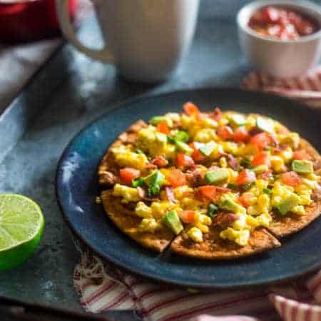 Homemade Healthy Breakfast Nachos - These spicy, healthy nachos are loaded with bacon, scrambled eggs, cheese and a Greek yogurt salsa for an easy, high protein & gluten free breakfast! | Foodfaithfitness.com | @FoodFaithFit