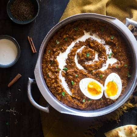 Slow Cooker Pumpkin Coconut Quinoa Egg Curry - This slow cooker curry is mixed with coconut milk, pumpkin, quinoa and topped with boiled eggs for an easy, healthy, fall meal for meatless Monday. Easily vegan friendly! | Foodfaithfitness.com | @FoodFaithFitness