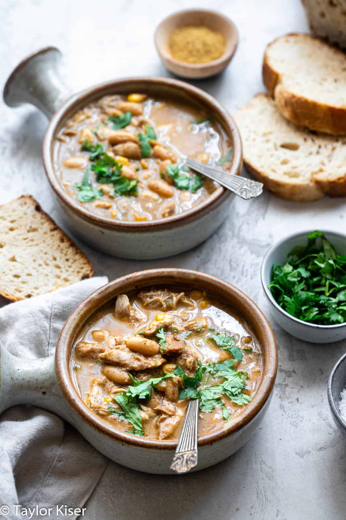 2 bowls of Crockpot White Chicken Chili on a table