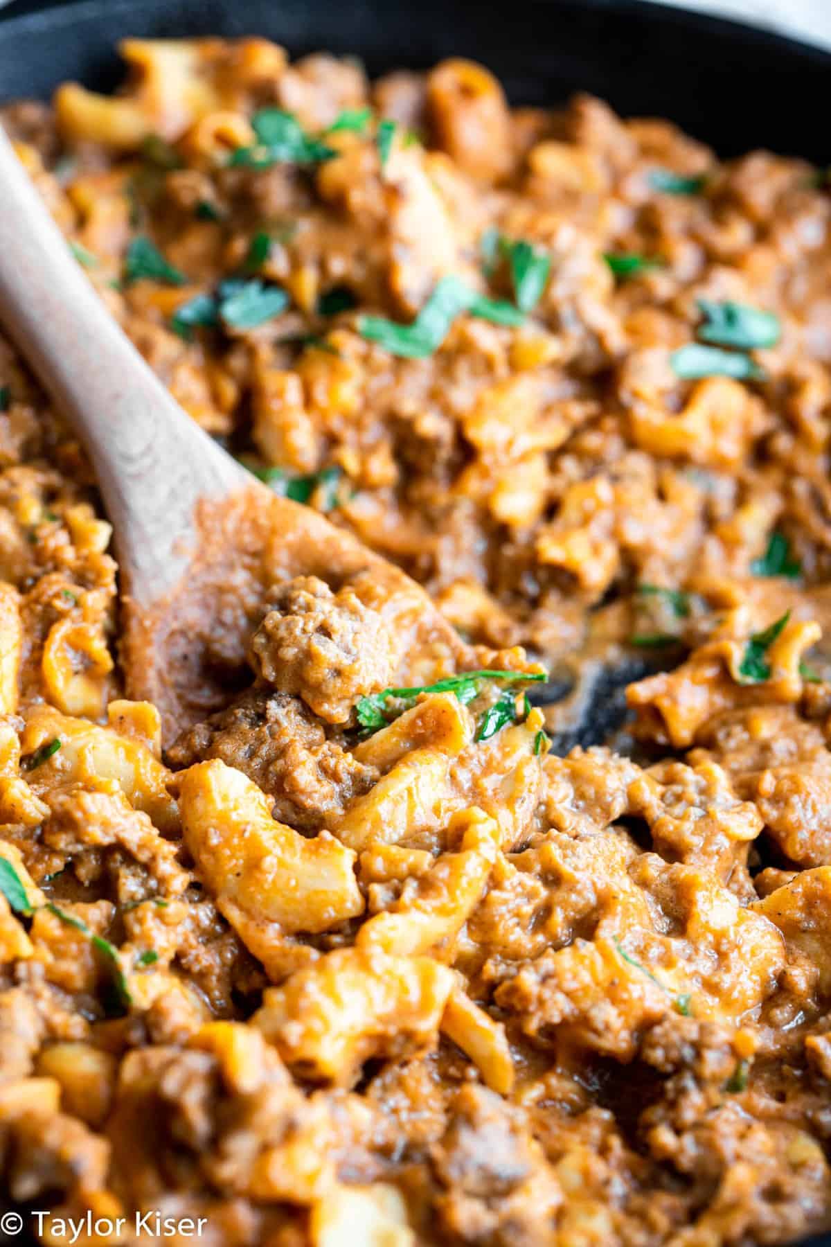 DIY hamburger helper in a skillet with a spoon