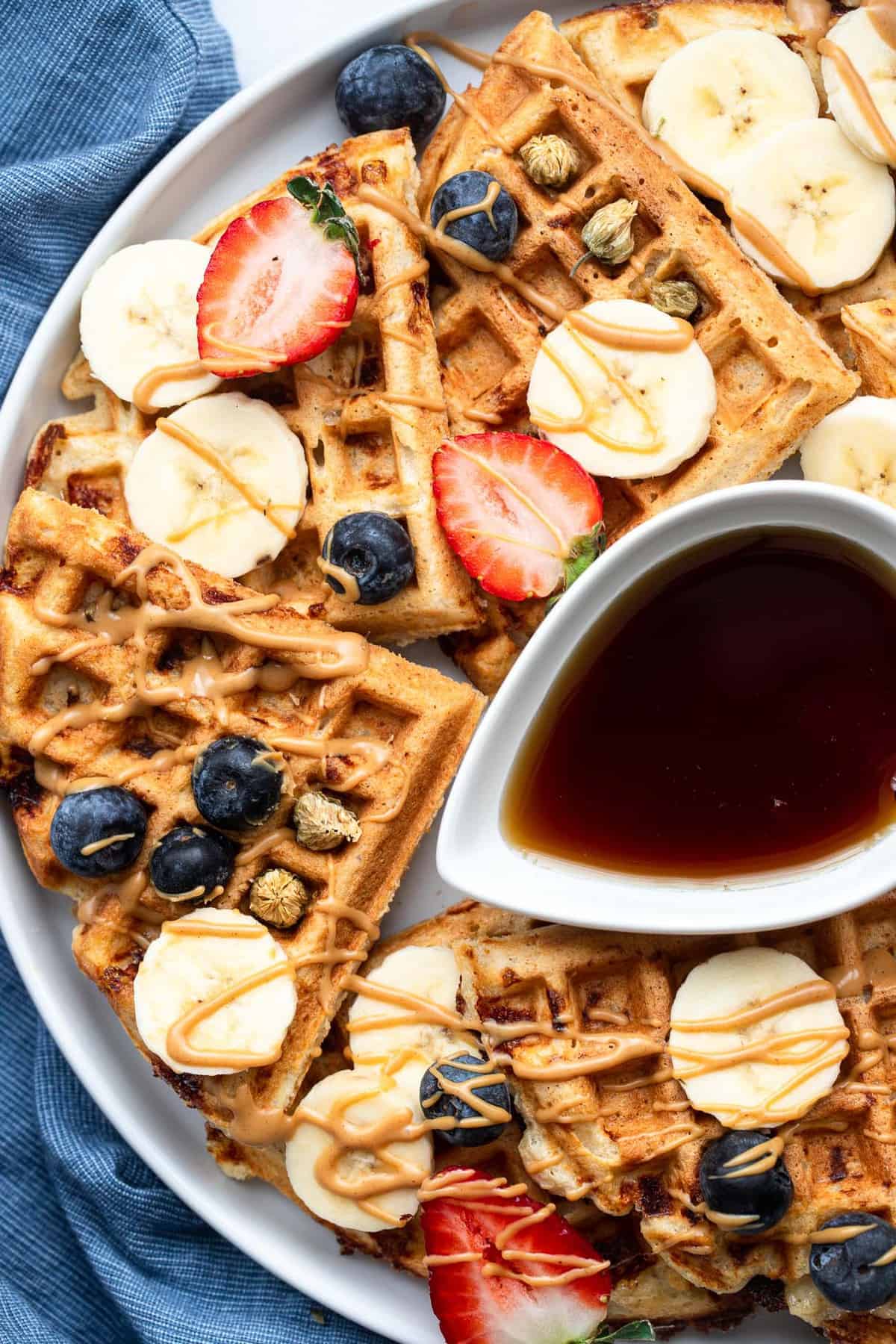 protein powder waffles with strawberries on top