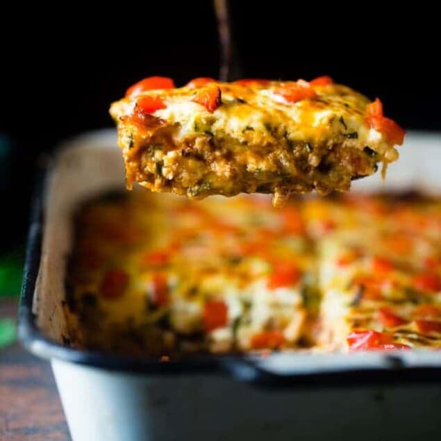 Mexican Zucchini Lasagna - This lasagna has all the cheesy, saucy taste but without the carbs and calories! It's a healthy, gluten free and protein-packed crowd-pleasing dinner that's only 280 calories! Make-ahead and freezer friendly too! | Foodfaithfitness.com | @FoodFaithFit