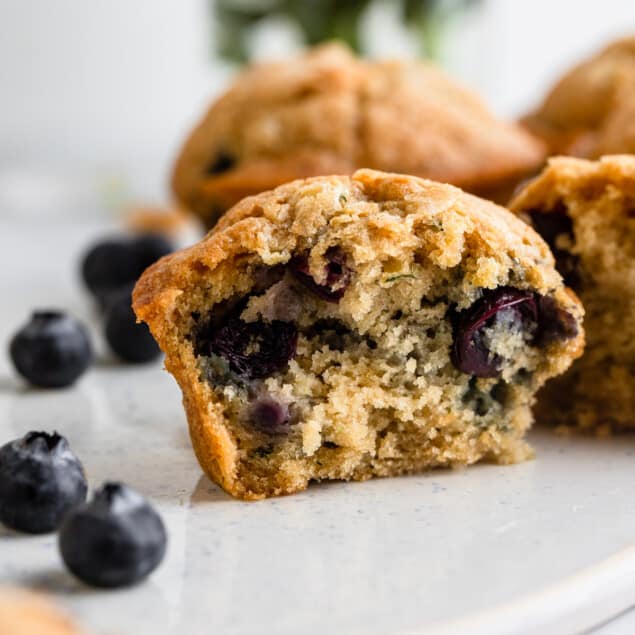 one Zucchini Blueberry Muffins cut in half